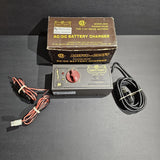 Aristo-Craft AC/DC battery charger with control dial and attached power cables