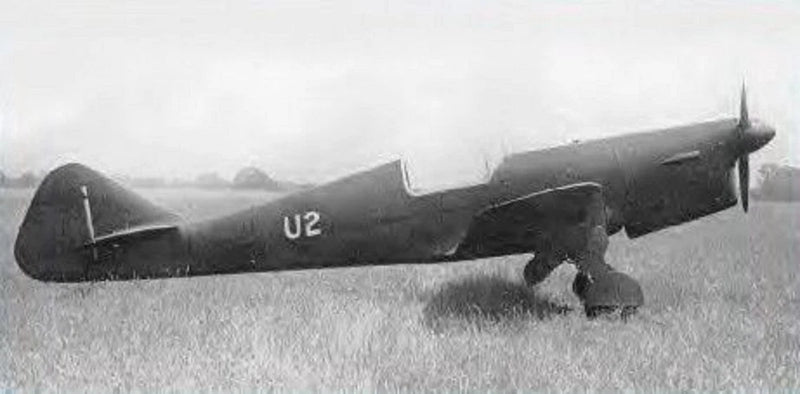 Small dark wood airplane model with U2 marking and landing gear