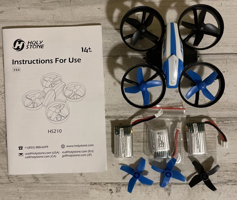 Blue mini quadcopter drone with four black propellers and spare propeller set