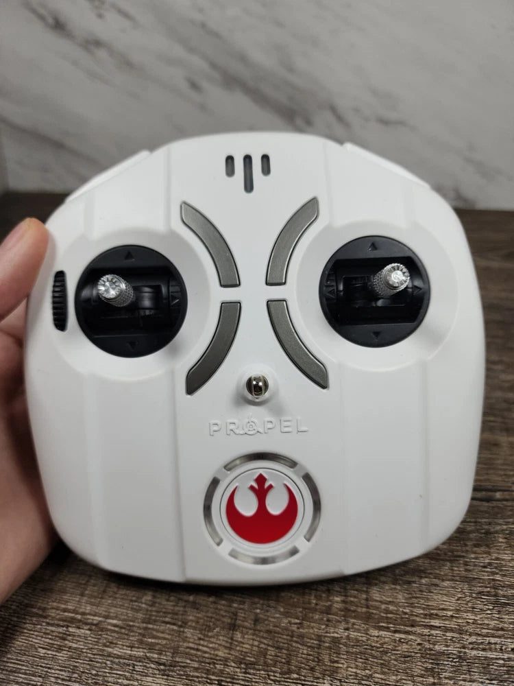 White Propel drone remote controller with dual thumb joysticks and red flame button