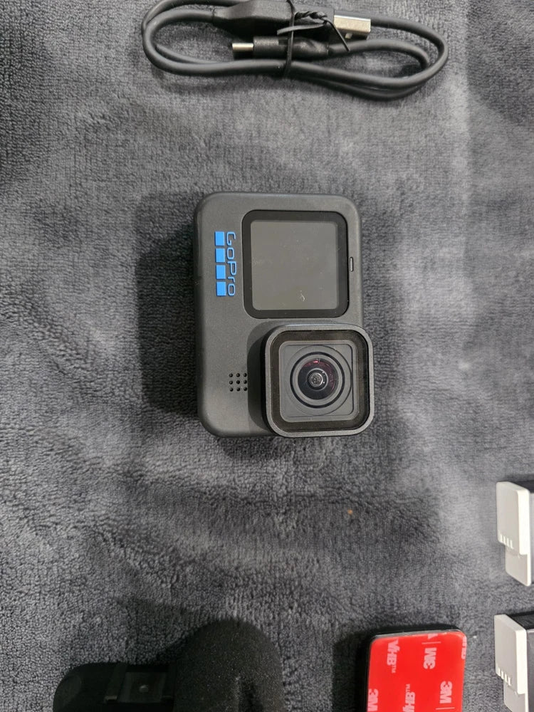 GoPro HERO11 action camera with front lens and color screen on dark housing