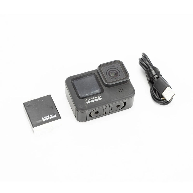 GoPro HERO9 Black action camera with front lens, screen, and USB cable