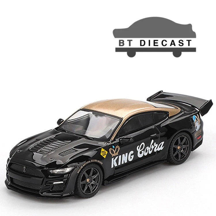 1/64 scale die-cast model car, black with gold Cobra graphics and rear spoiler