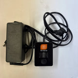 RC battery charger with AC power adapter and power cable, compact black design