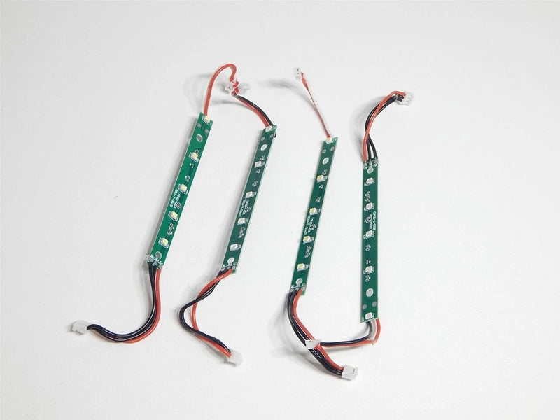 Set of four green LED strip PCBs with motor arm wiring for FPV drones