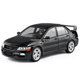 Black 1/24 Mitsubishi Lancer EVO IX diecast model car, front 3/4 view, sporty wheels
