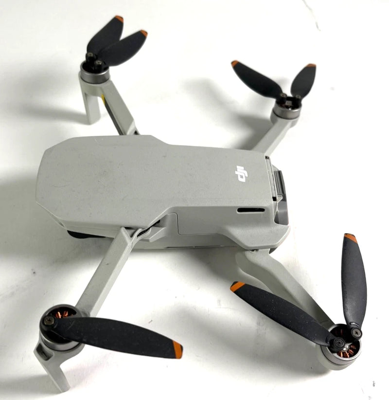 DJI Mini 2 quadcopter drone with four propellers, white body