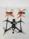 GEPRC Crocodile Baby 5 drone with four orange propellers and FPV camera module