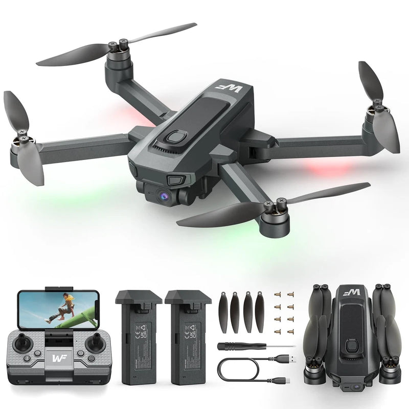 Foldable black RC drone with 4 propellers and FPV camera, with controller and spare parts