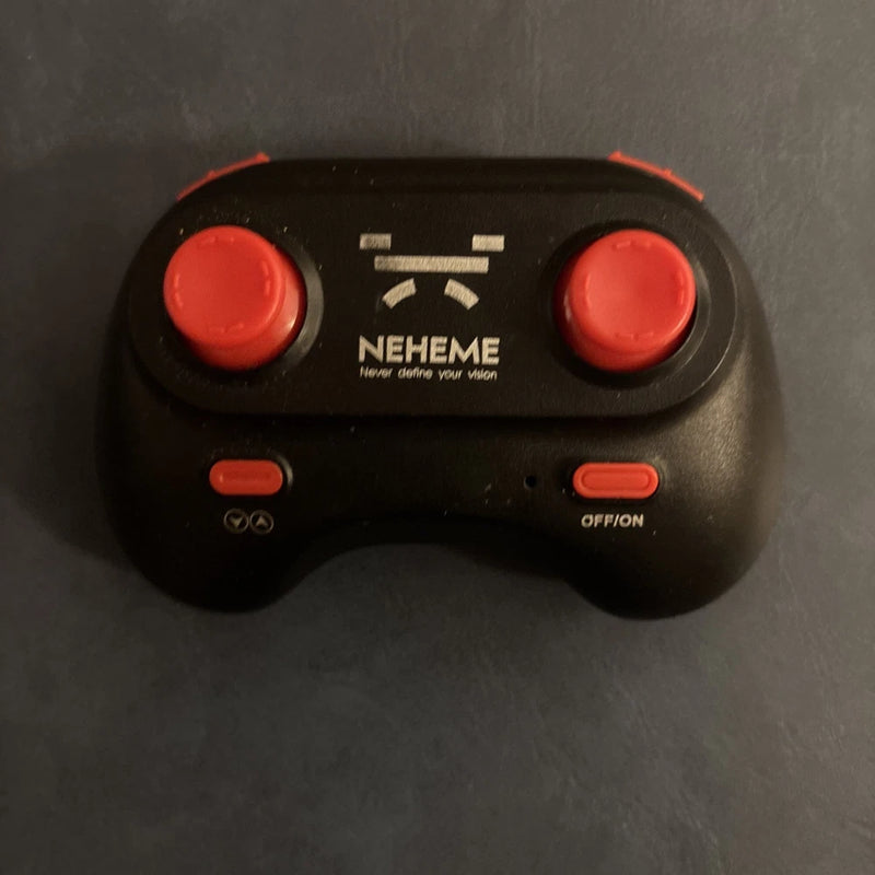 Black drone replacement remote control with two red thumbsticks and NEHEME logo