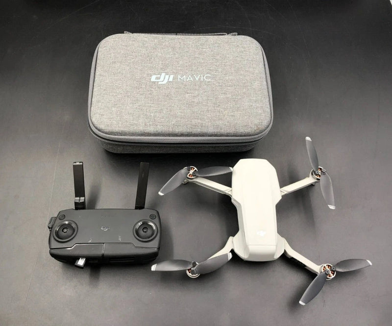 Ultra-light DJI drone kit with remote, propellers, and hard travel case