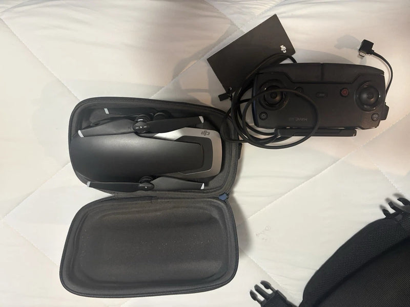 Camera drone with controller in black zip carry case