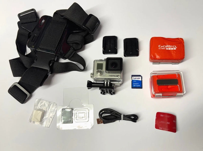 GoPro action camera with black chest mount and waterproof housing, plus red storage case