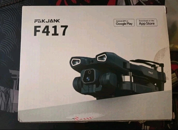 Black camera drone shown in retail packaging box with app download icons