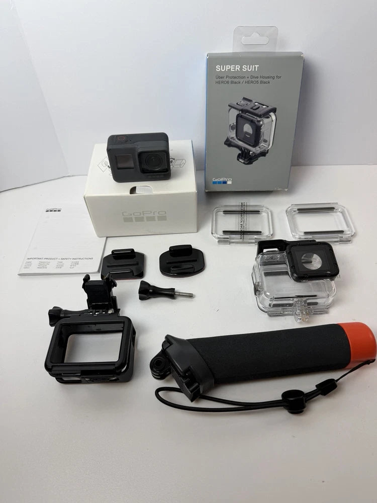 Action camera in clear protective housing with Super Suit accessories and handle