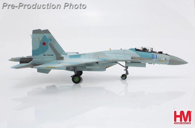 Blue and gray Su-35S scale model fighter jet with '01' marking on nose