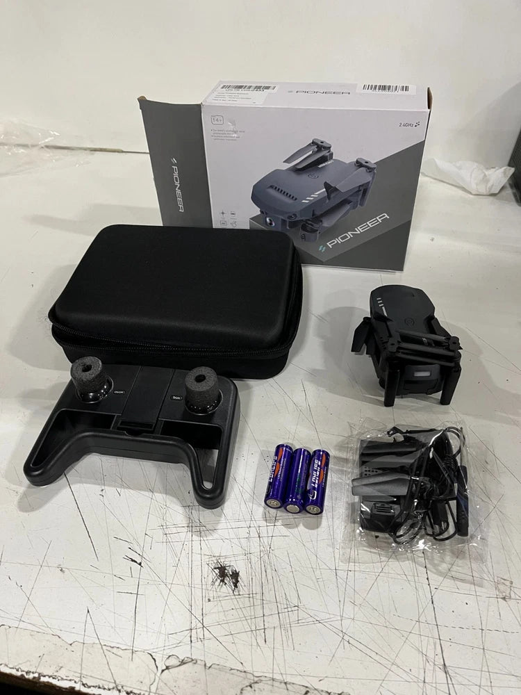 Used quadcopter drone kit: dark drone, controller, hard case, batteries