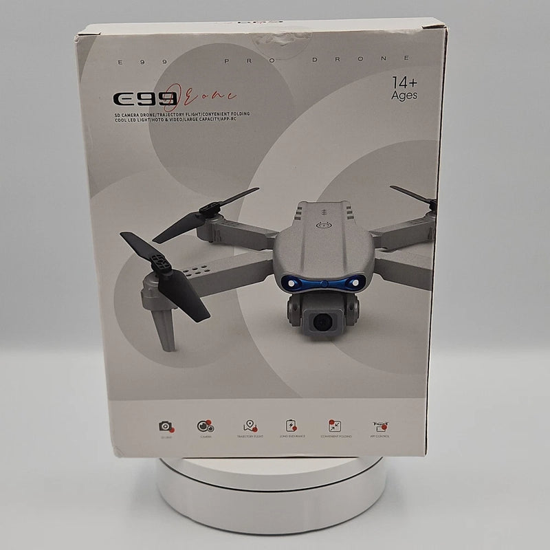 Foldable RC quadcopter drone package with printed drone and control icons