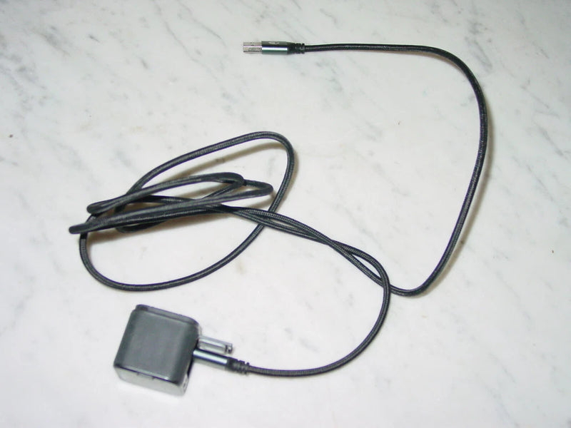 Black power adapter with cable for action camera