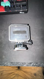 GoPro Hero Plus in clear waterproof housing with metal mounting bracket