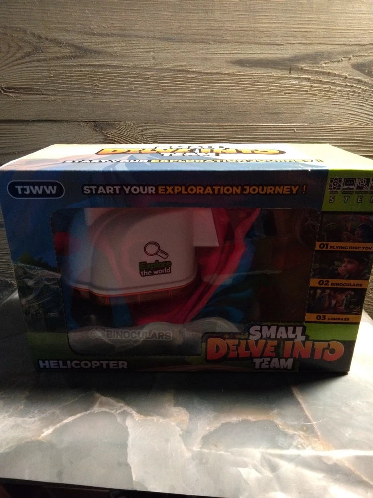 Small team helicopter toy in retail box packaging with colorful graphics
