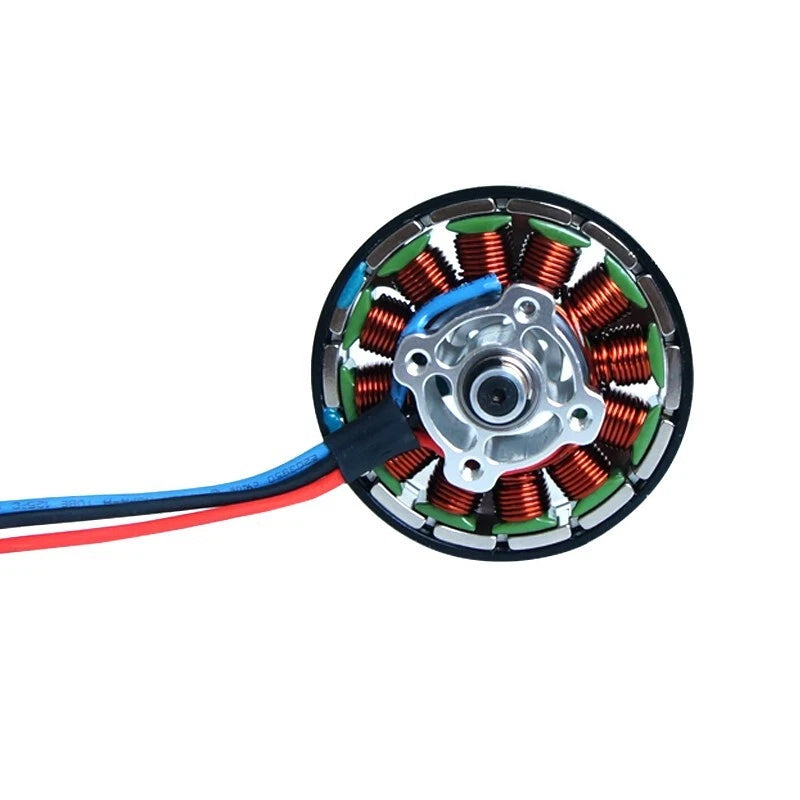Brushless RC drone motor with copper windings and colored wire leads, circular stator
