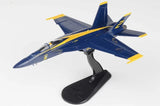 1/72 scale F/A-18E model jet in USN Blue Angels livery with yellow accents on stand