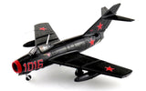 Black-gray die-cast jet fighter model with red stars and cockpit, landing gear visible