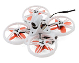 Analog-ready quadcopter drone with four white orange propellers and compact white frame