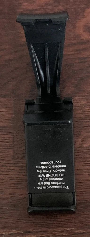 Black plastic drone controller phone attachment clip with latch