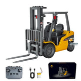 Mini electric RC forklift toy with yellow cab, gray mast and forks; handheld controller included