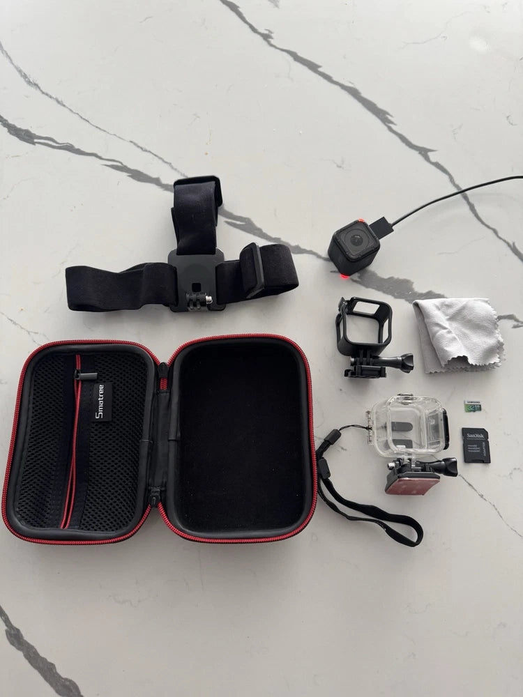 GoPro HERO4 Session action camera kit with protective case, mounting straps, and accessories
