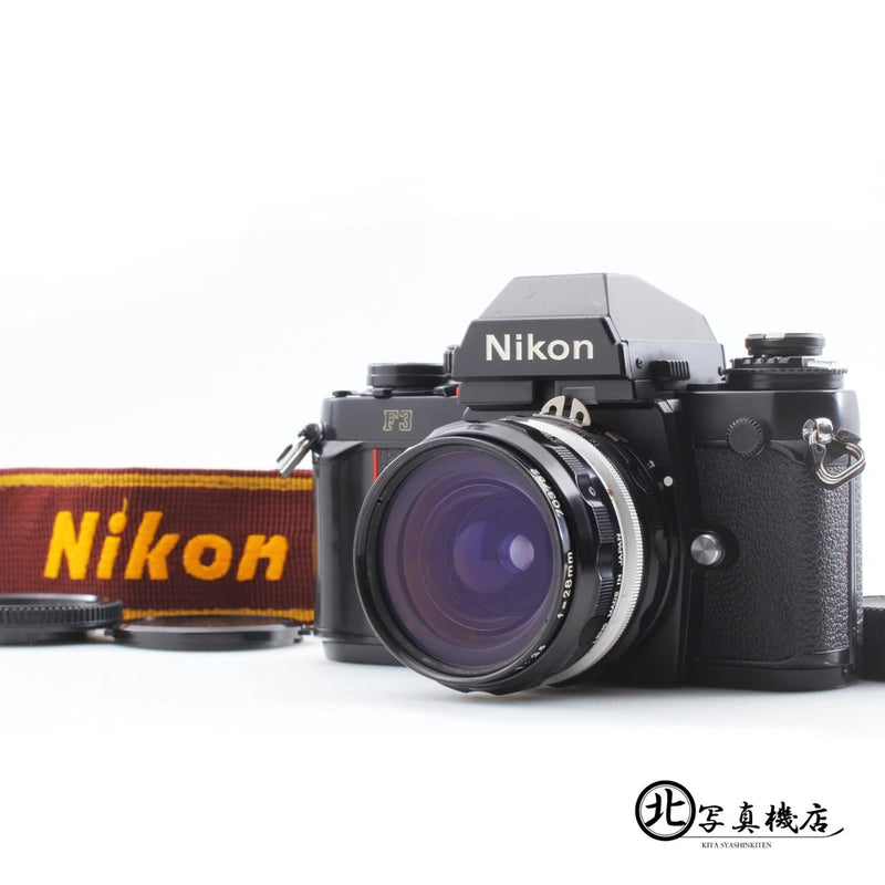 Black Nikon F3 35mm film camera with 28mm f/3.5 lens and Nikon strap