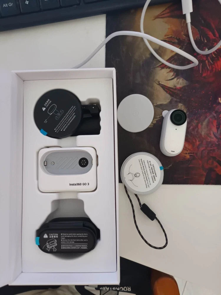 Insta360 Go 3 white action camera kit with charging case and mount