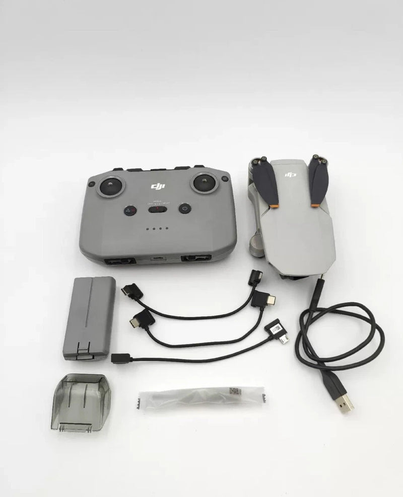 DJI drone controller with cables and charging adapters