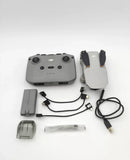 DJI drone controller with cables and charging adapters