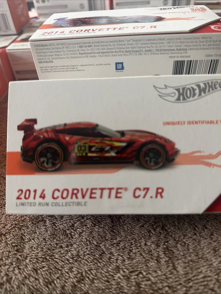 Red and black Hot Wheels die-cast Corvette C7.R 1:64 model in display box