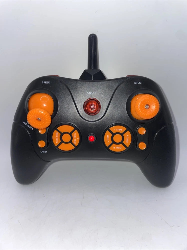 RC remote control with antenna, orange buttons, and speed/stunt controls