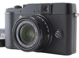 Fujifilm X Series X10 compact digital camera with black body and attached lens