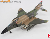 1/72 F-4C Phantom fighter jet model with green camouflage and underwing missiles