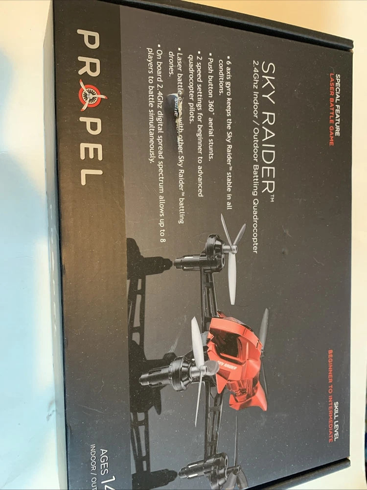 Orange quadcopter drone on retail box with product name and specs