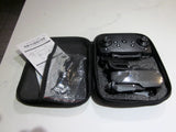 Foldable black drone in zippered carry case with controller and accessories