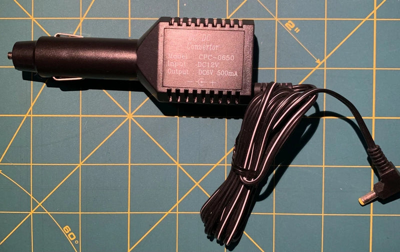 Car cigarette lighter DC-DC converter adapter with cable and plug, black.