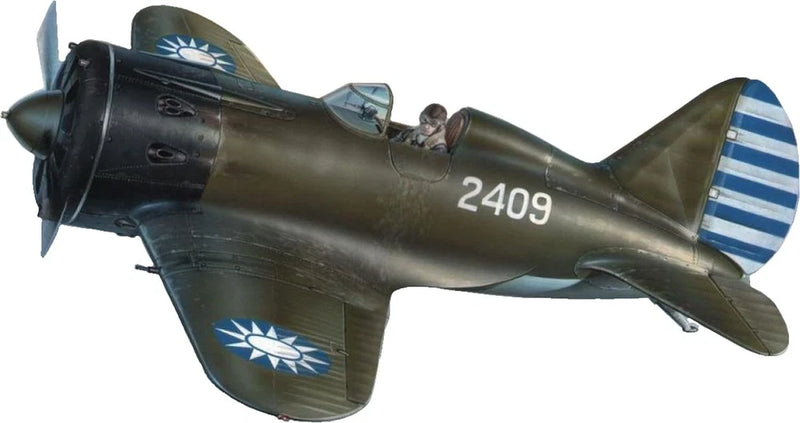 Olive green fighter plane model with blue roundel, tail stripes, and 2409 marking