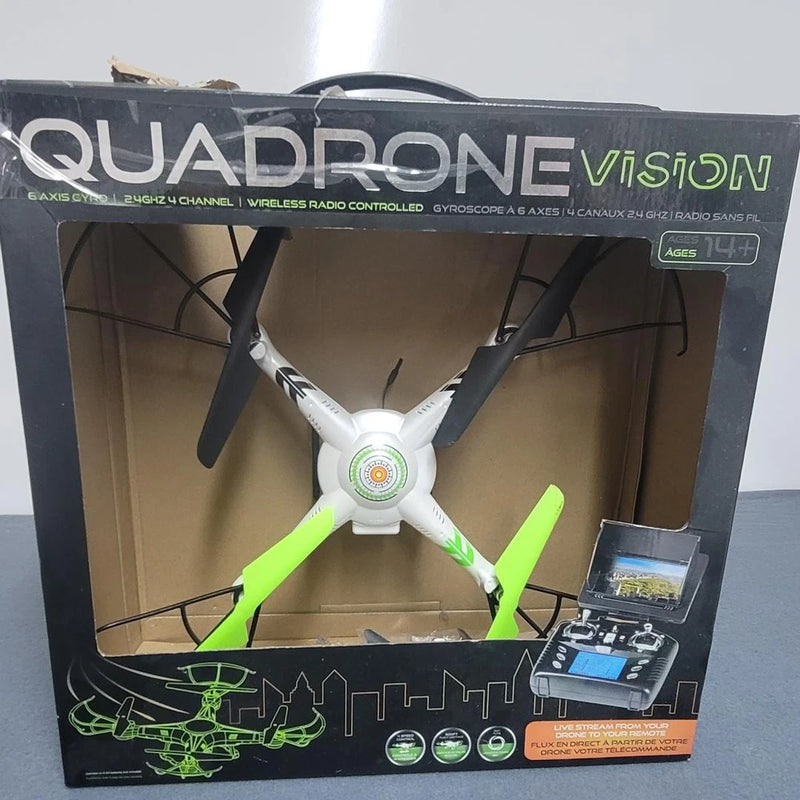 Quadrone Vision boxed quadcopter drone with four green-bladed rotors and controller