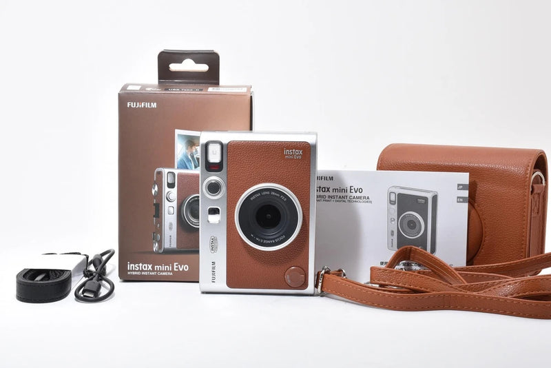 FUJIFILM instax mini Evo instant camera in brown with wrist strap and leather case