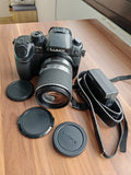 panasonic lumix dmc gh4 with lens tamron 14-150