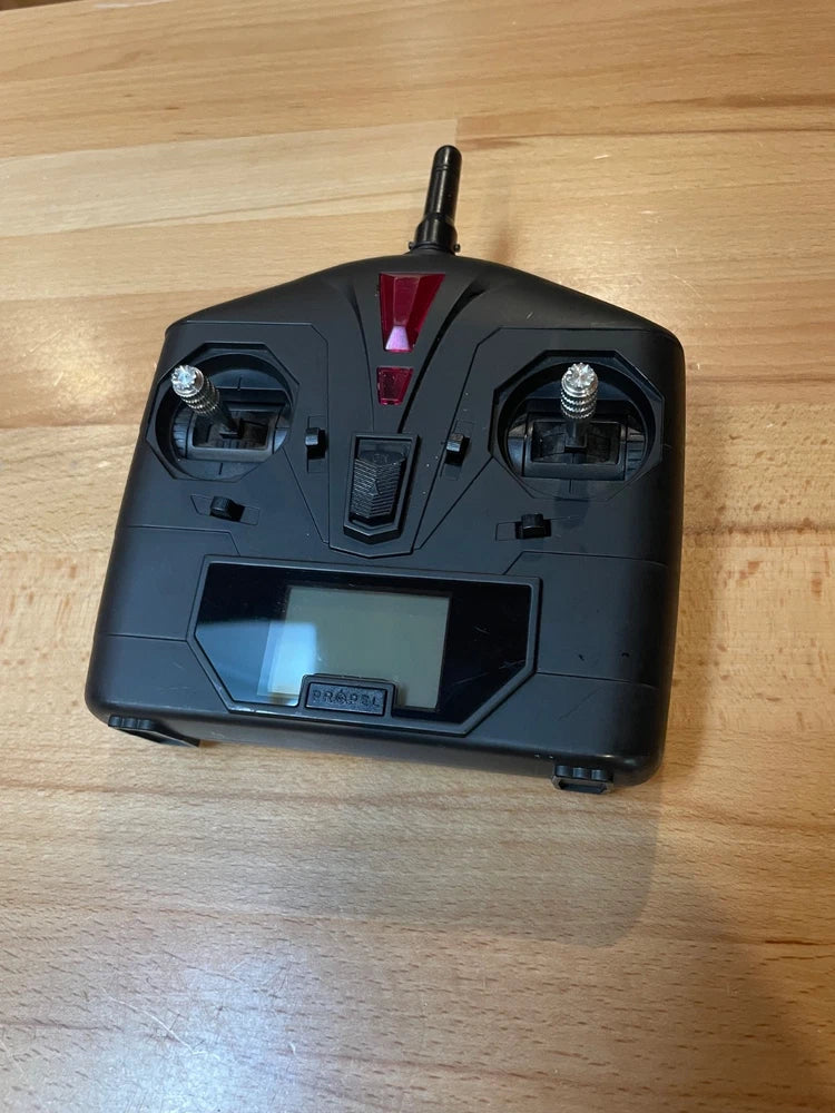 Dark gray drone remote with built-in screen and antenna