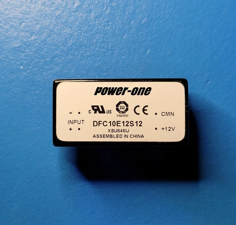 Power-one isolated DC-DC converter module with INPUT/OUTPUT label and +12V marking