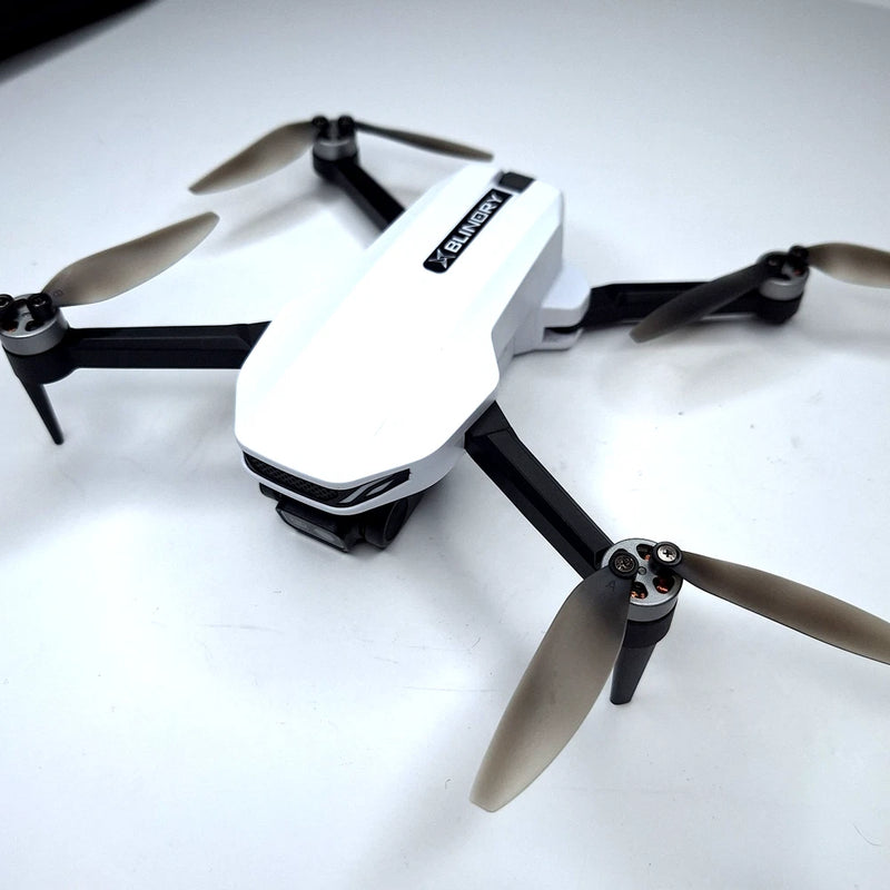 White quadcopter drone with four propellers